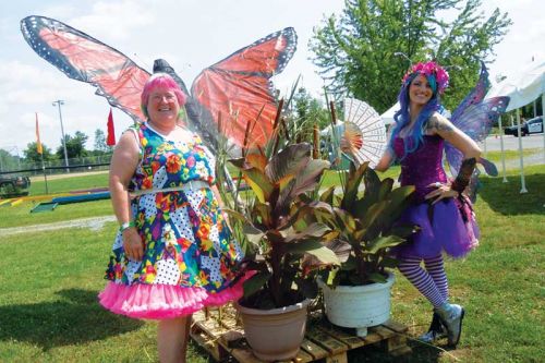 Debbie Lovegrove and Lily the Fairy strike a pose with Asselstine Hardware's butterfly float ornament